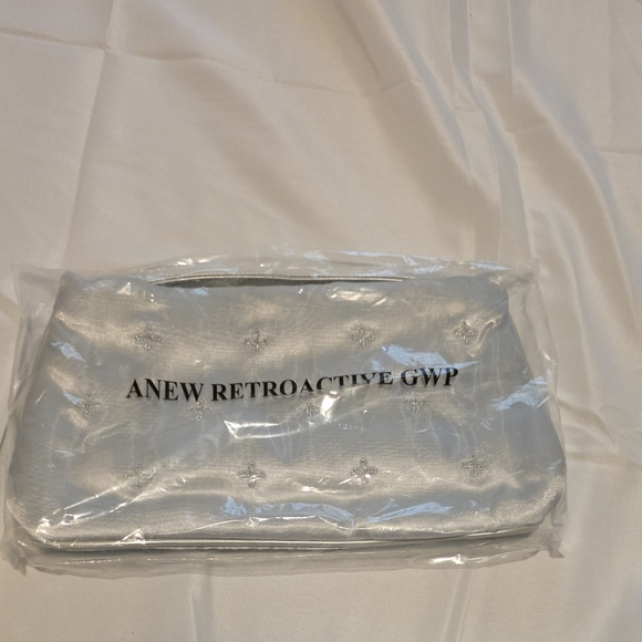Avon Handbags - Avon Silver Cosmetic Bag